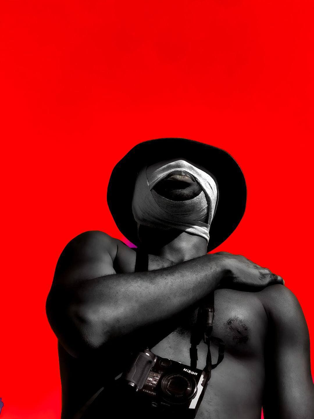 Man with bandage on red background